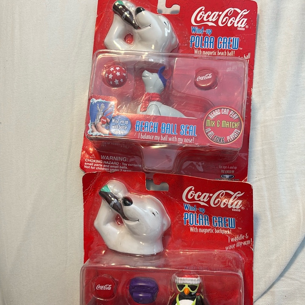 Two new Coca Cola wind up figurines with accessories